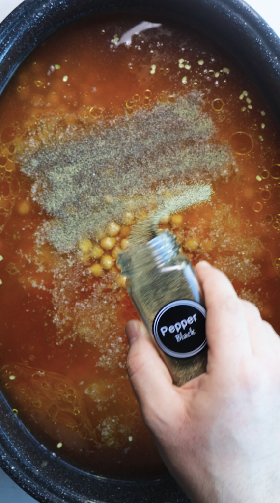 1. Add rinsed rice and mung beans to a large Dutch oven, then add water, beef broth, tomato sauce, oil, chickpeas, seasonings, and cilantro. 